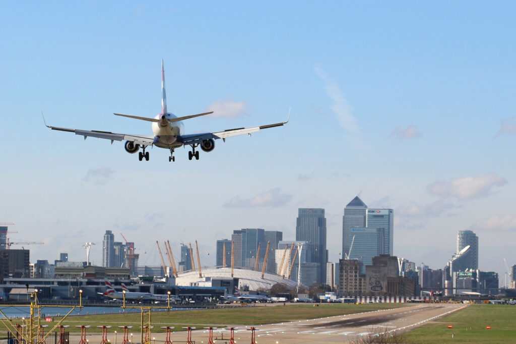 British Airways Plane landing at London's City Airport on a sunny day