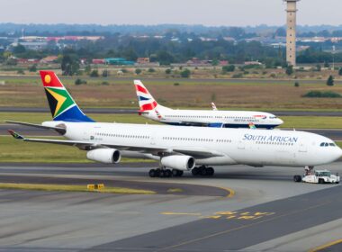 johannesburg__south_africa_march_30_2019_south_african_airways_airbus_a340_and_british_airways_comair_boeing_737_at_o._r._tambo_international_airport._domestic_market_share_competition..jpg